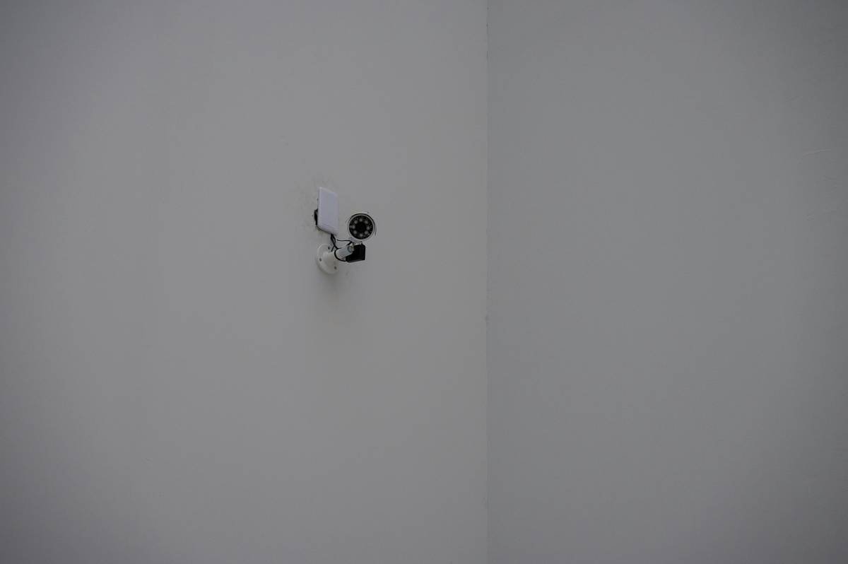 A close-up image of a hardware button labeled 'Kill Switch' next to a sleek modern router